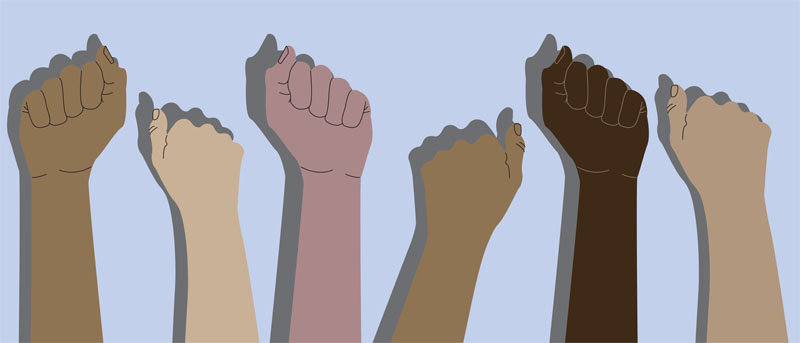 Human hands with clenched fists. Protest, stop racism, equality concept. Fight for your rights. People of different nationalities and races raise up fists.